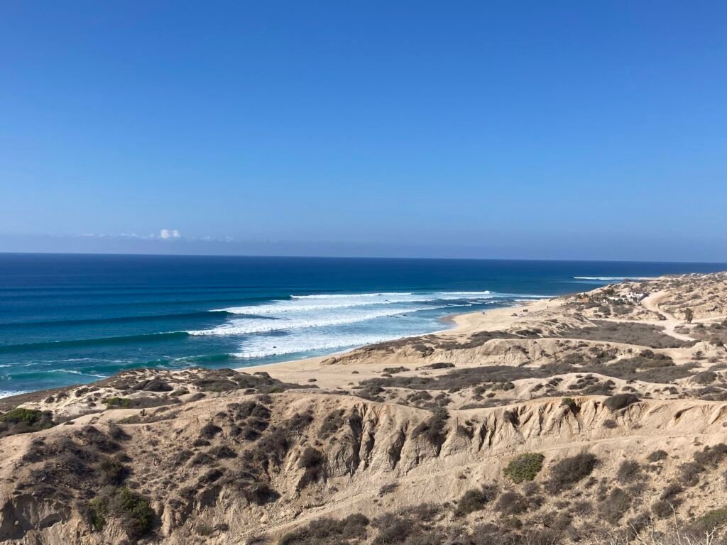 Lines of incoming waves meet the desert near ALAIA Surf Lodge, La Fortuna, California Baja Sur, Mexico