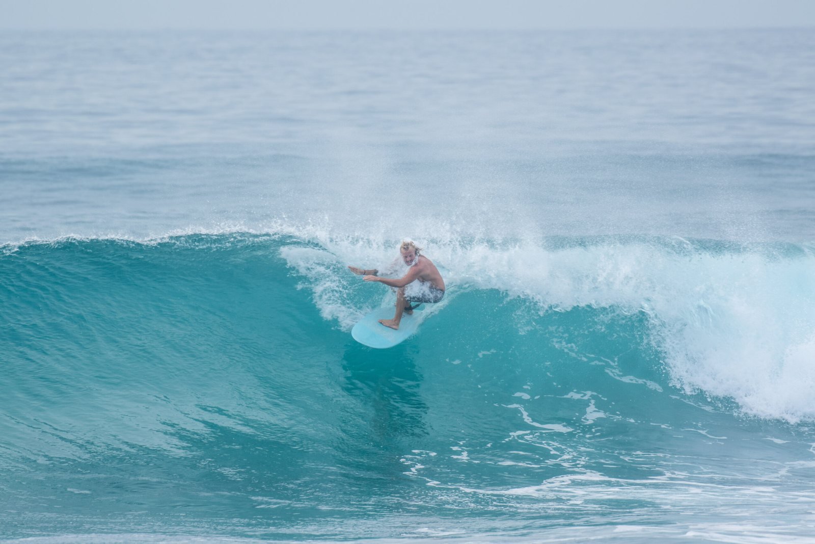 Surfer on a wave on the East Cape near ALAIA Surf Lodge
